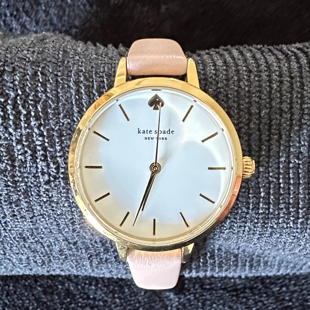 kate spade gold case watch with light pink leather strap